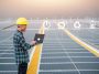 Asian Engineer use computer  Checking Solar power Energy in factory