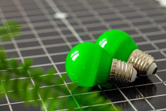 Solar energy panel and light bulb, green energy concept