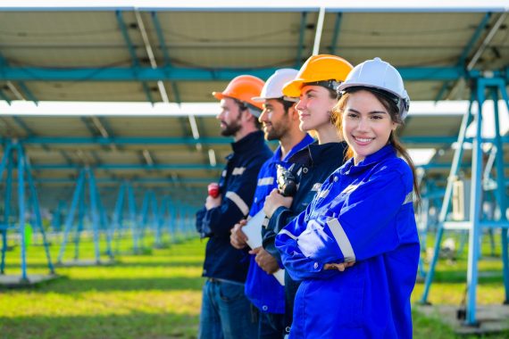 Workers installing solar panels, Engineer team at solar panel farm, Group of workers analyzing solar energy at solar cell farm field
